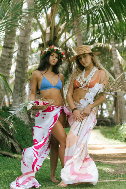 Summer '23 Drop #1 includes luxury Hawaiian Beach towels and blankets. Also a beautiful woven tote bag, sport and spice visor and beautiful Hawaiian Pareus. We have everything you need for the your beach day!